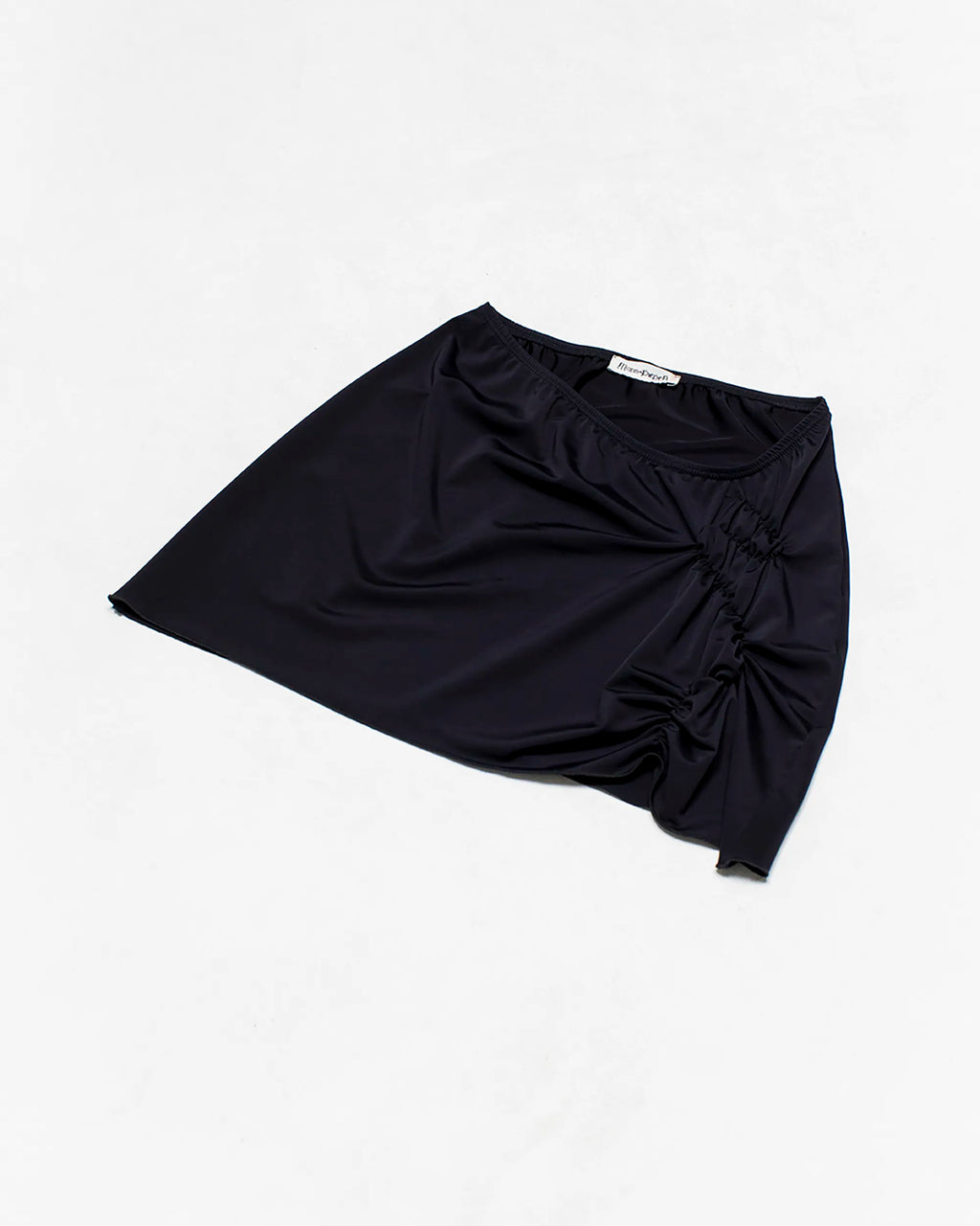 black mini skirt with ruching detail on the front side