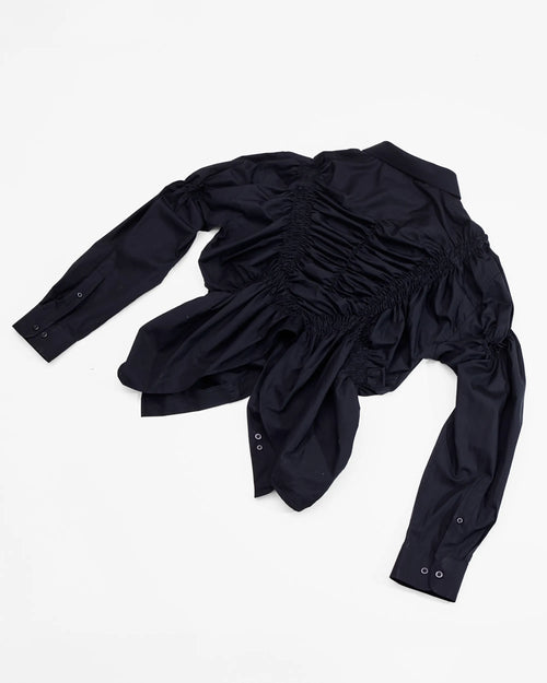 back view of black shirt with shirring details