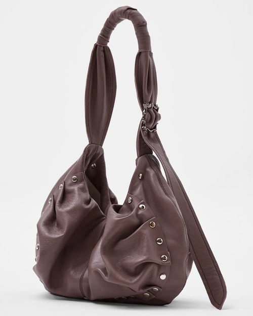 mauve leather shoulder bag with bespoke buckle and ruching